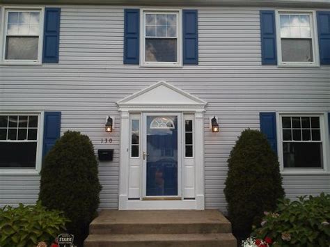 grey house with navy shutters